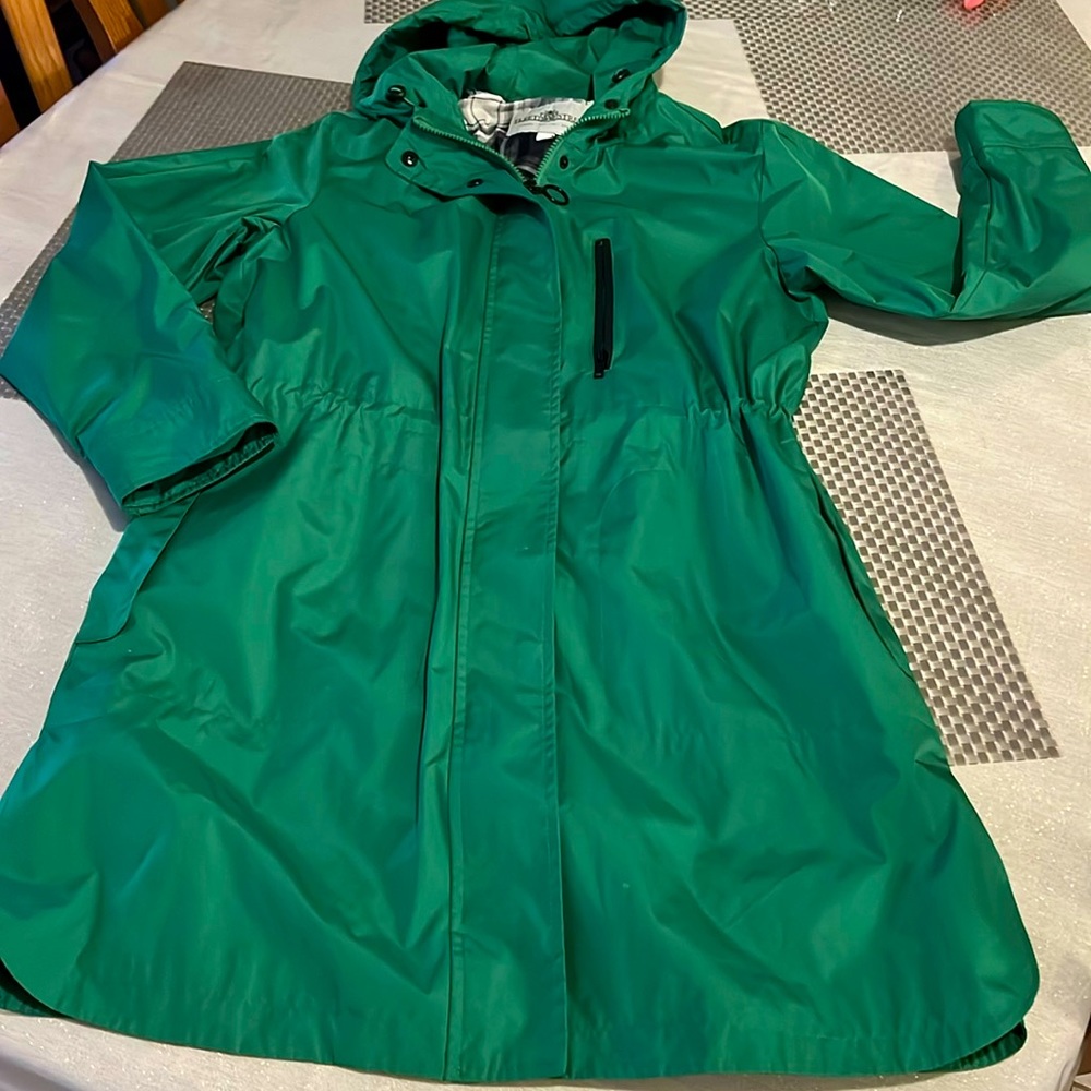 Green rain coat with a lining.